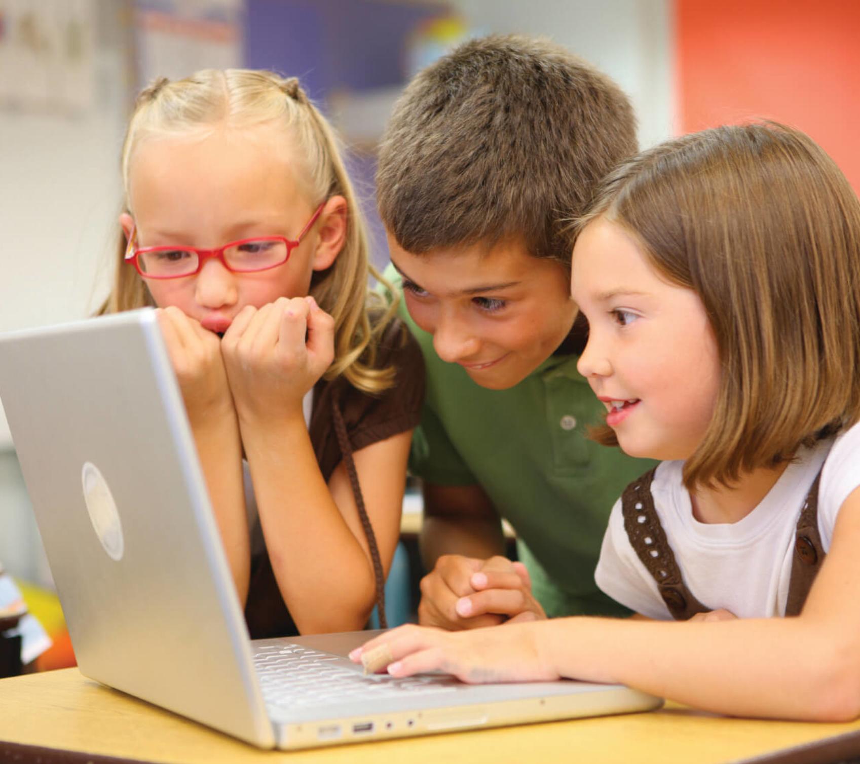 kids looking at a laptop