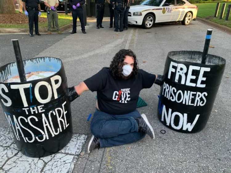 cementing himself in front of Governor’s Mansion