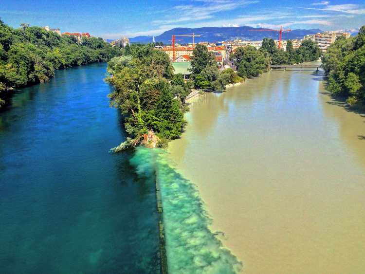 Color clashing confluence of the Rhone and Arve Rivers in Switzerland