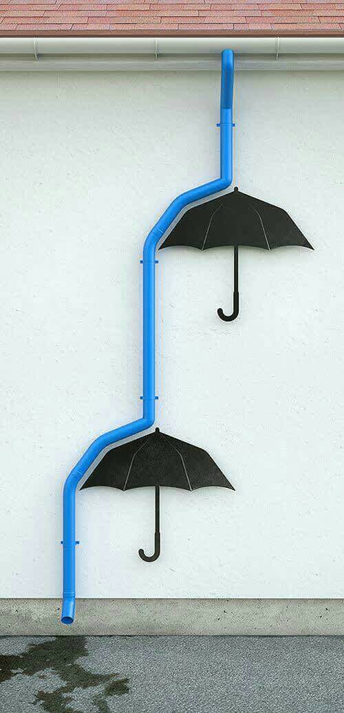 Drain pipe bouncing on umbrellas street art 