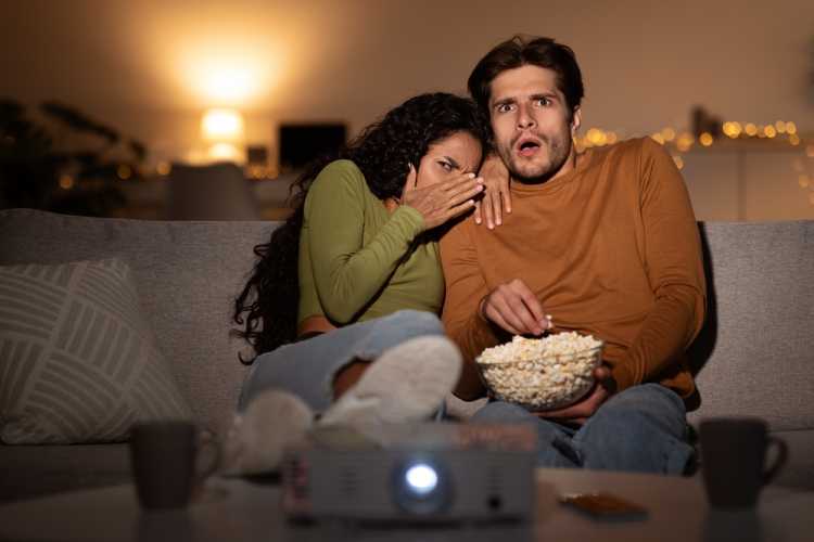 movie date couple watching horror scary movie