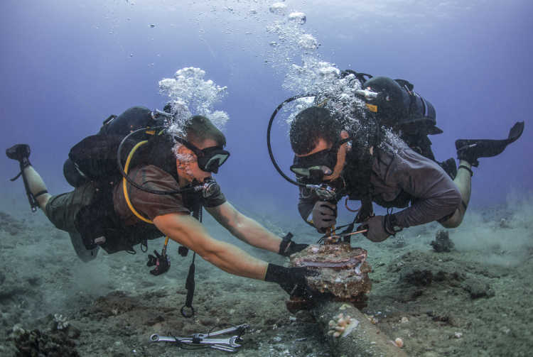 Seabees remove corroded zinc anodes from an undersea cable. (28073762161)