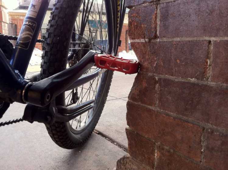 Bike Store Corner Wall chipped by pedal over 30 years