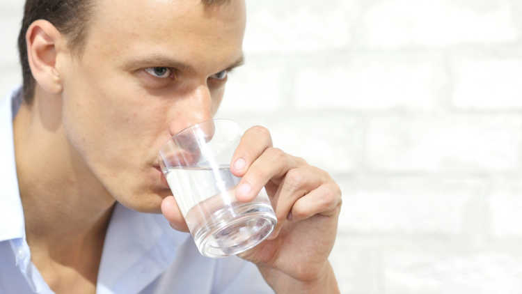 man drinking water