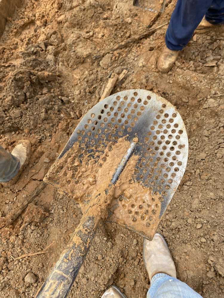 mud shovel with holes
