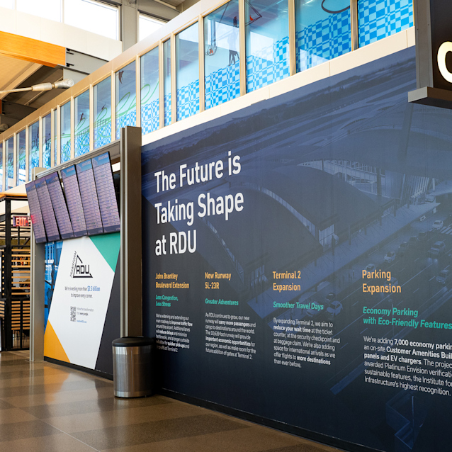 Airport terminal display showing Transform RDU expansion projects