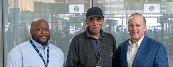 Airport contract employee being awarded a world class service award for outstanding customer service. 