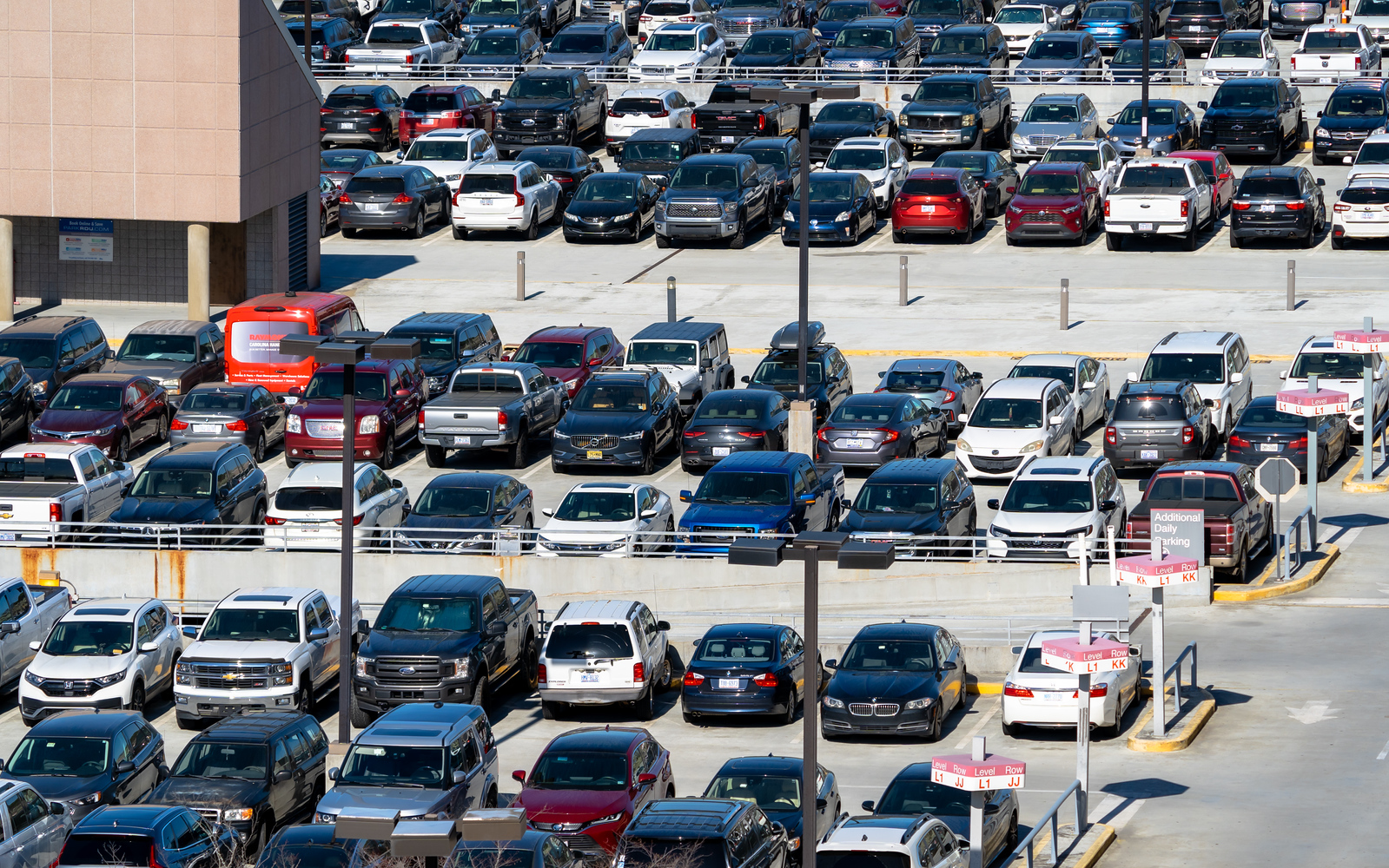 Central Parking with numerous cars in various colors including white, black, red, and blue.