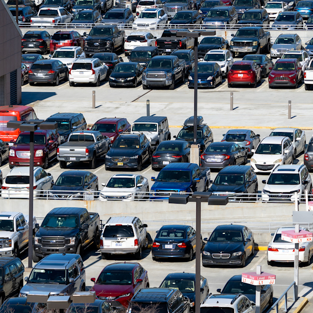 Central Parking with numerous cars in various colors including white, black, red, and blue.