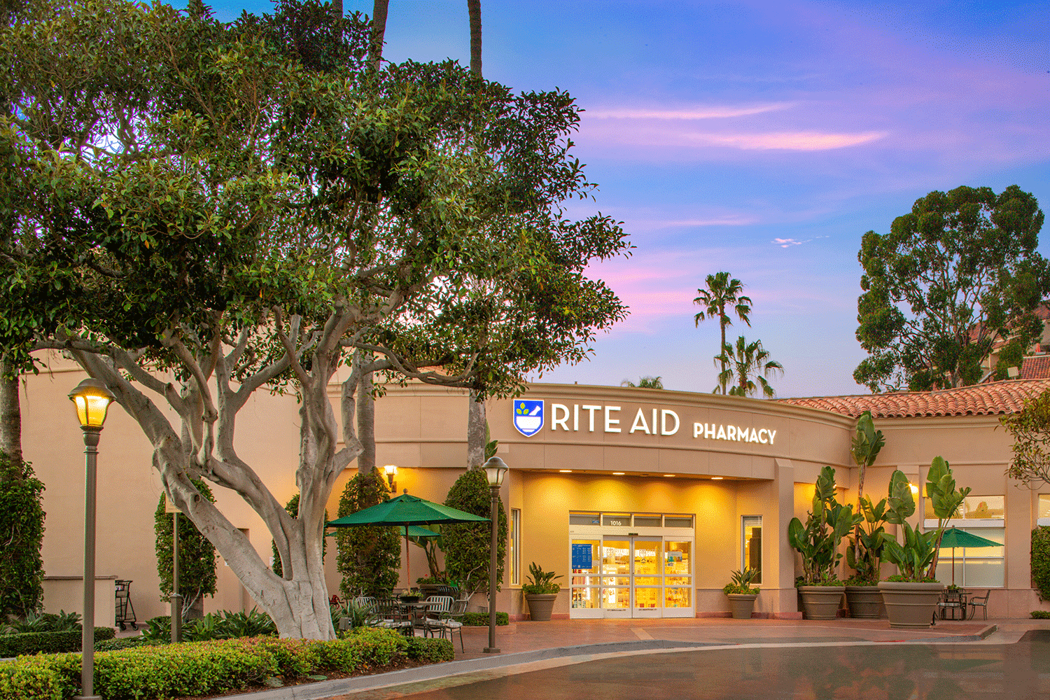  View of Rite Aid Pharmacy at dusk in Bayside Shopping Center 
