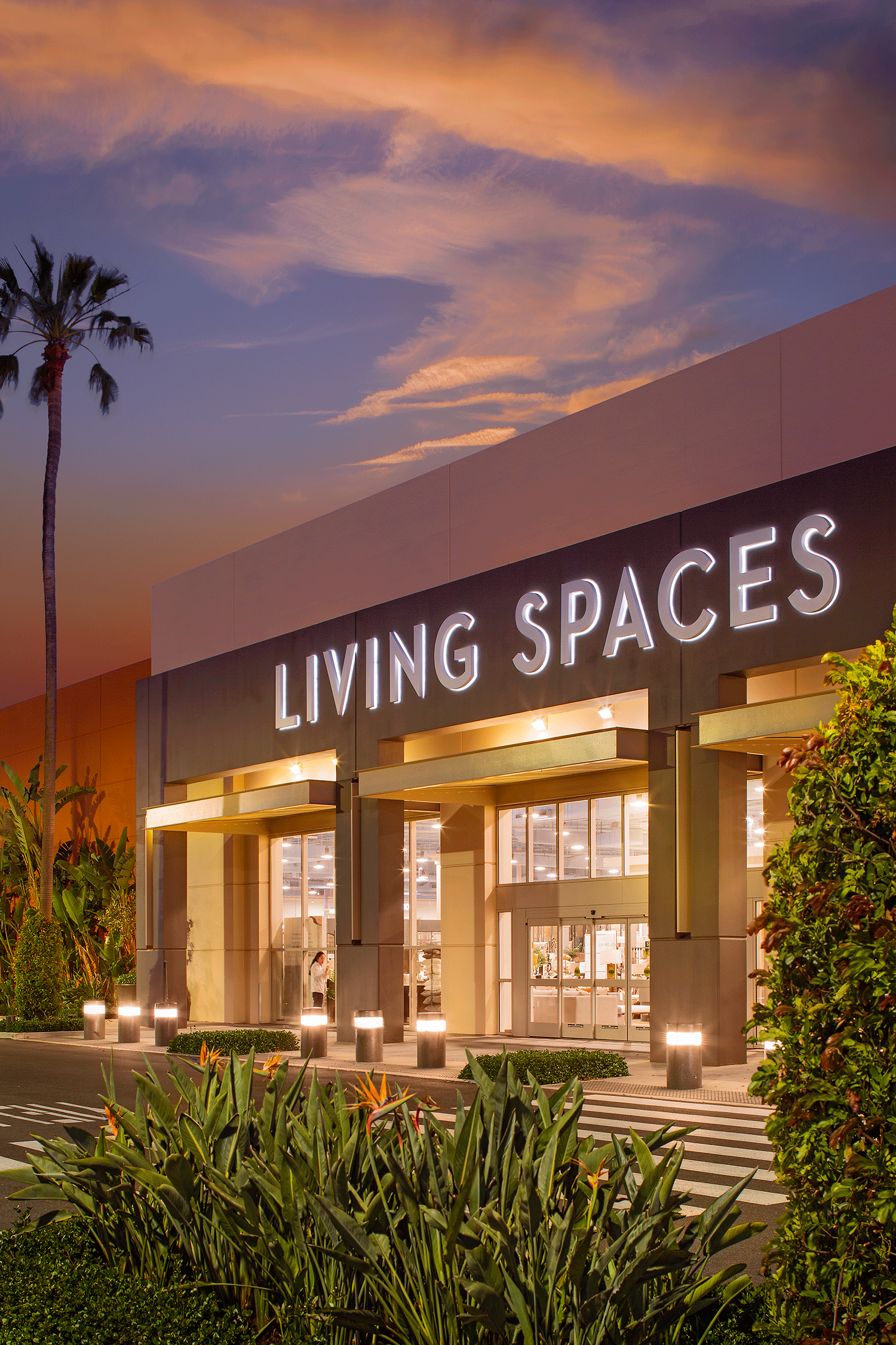  View of Living Spaces at dusk in Alton Marketplace | Irvine Spectrum®