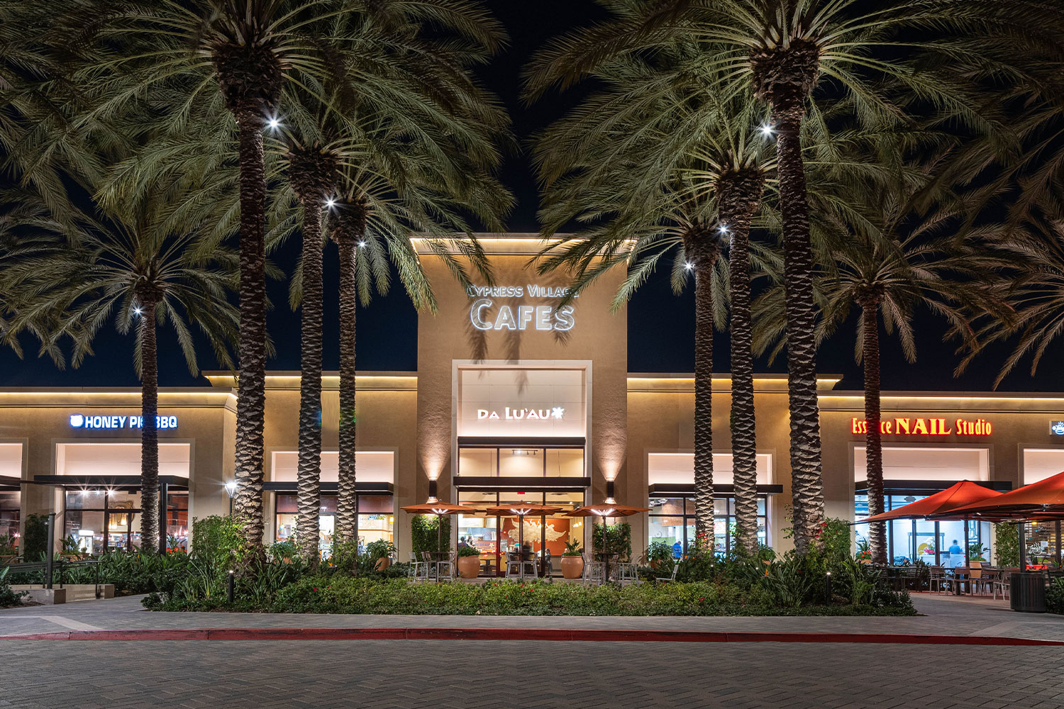  View of Cypress Village Shopping Center at dusk 