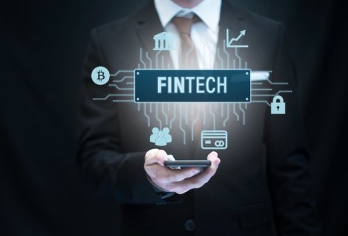 Business Person Holding Smartphone with Fintech Icon
