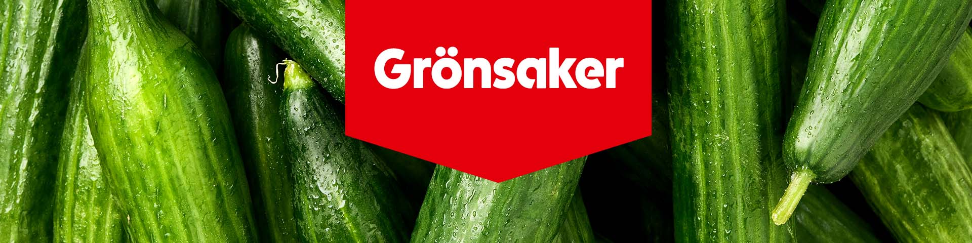 Färska gurkor med texten "Grönsaker".