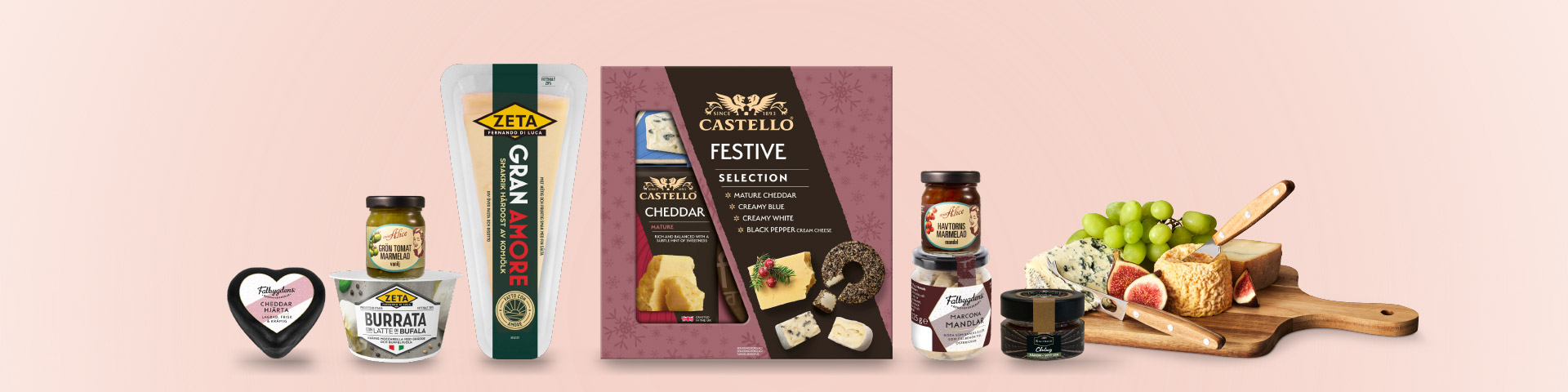 Olika ostar och tillbehör, bland annat cheddarhjärta, burrata, Gran Amore hårdost, Castello Festive Selection, marmelad, mandlar och en ostbricka med vindruvor och fikon, med texten “Klicka för att handla.”