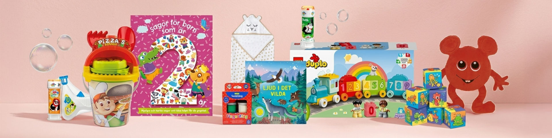 Leksaker och presentidéer för de minsta, med bland annat böcker, Duplo-tåg, mjuka figurer, pyssel, bubbelmaskin och små leksaker samlade som presenter. Klicka för att handla presenter.