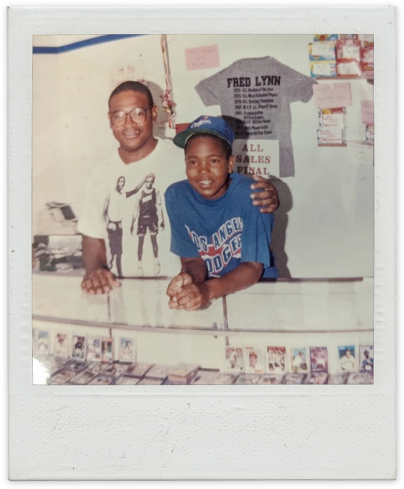 Robbie Sr. and Robbie Jr. standing at the counter of the card shop