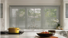 Grey aluminum blinds in a kitchen.