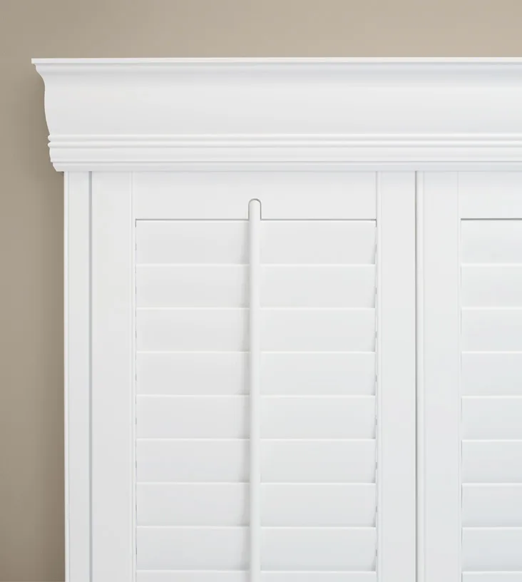 Window shutter with a decorative valance.