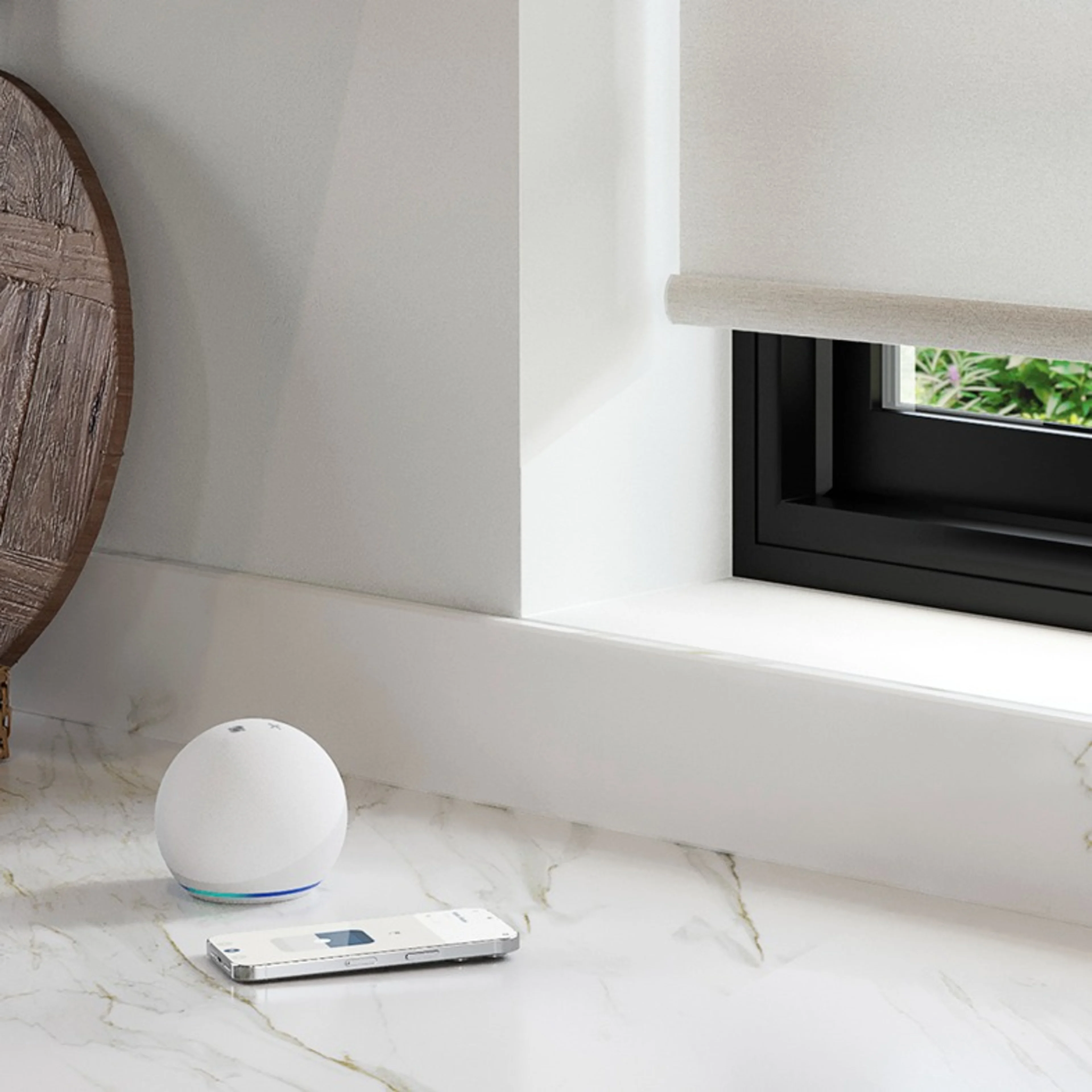 Smart home window treatments in modern kitchen window powered by Echo Dot