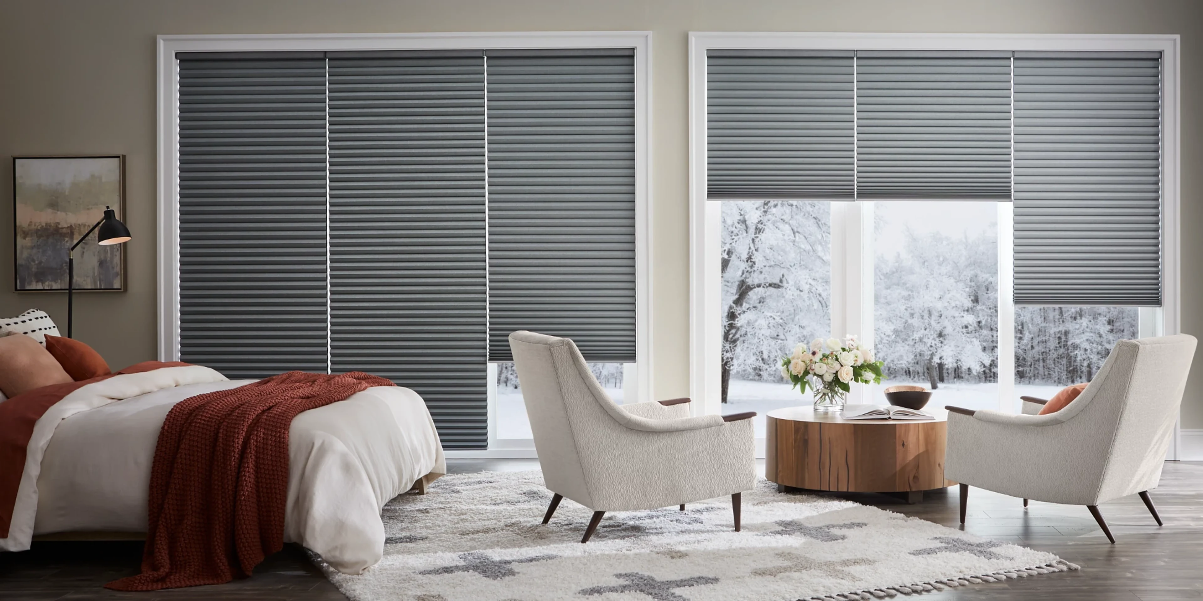 Insulating blackout honeycomb shades in a cozy modern bedroom.