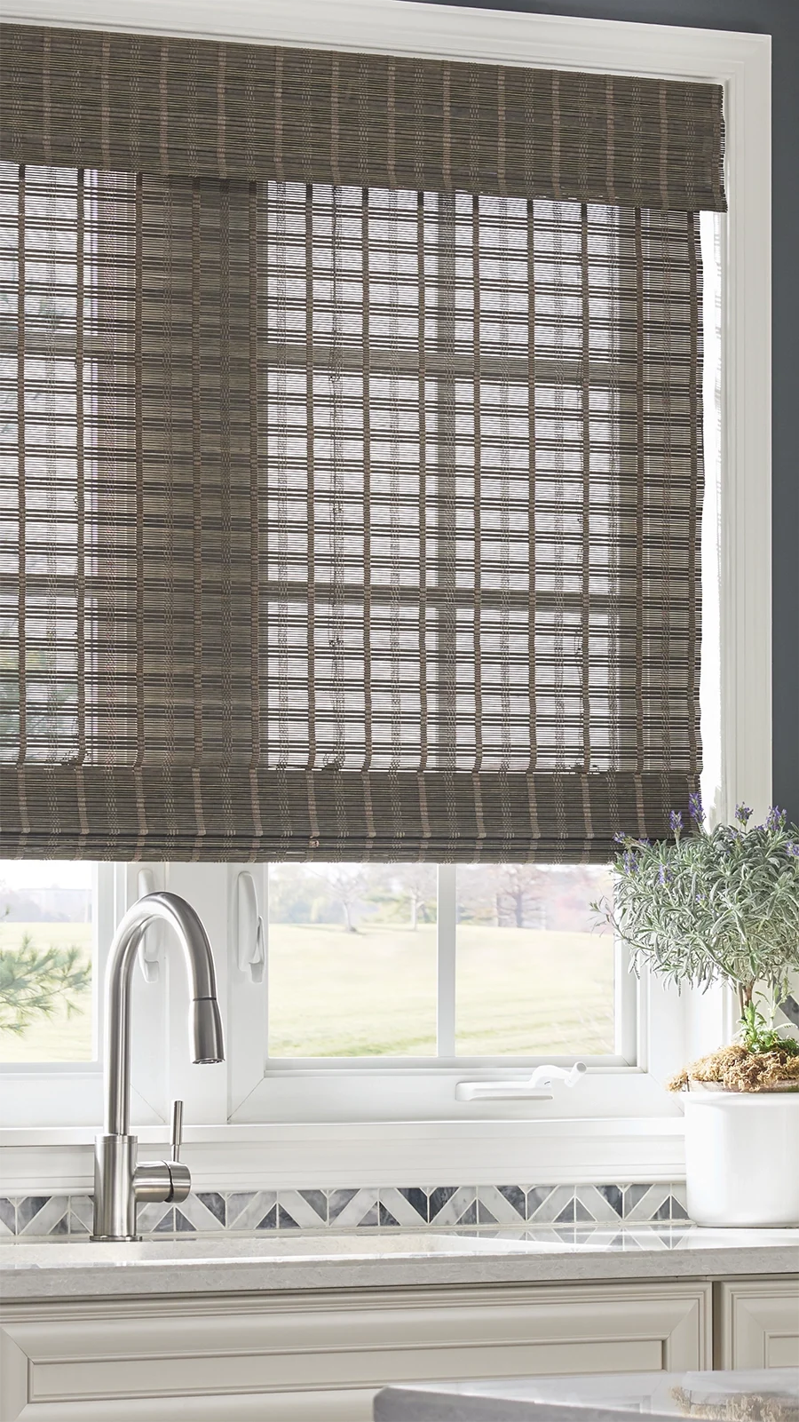 Close up of a natural woven shade in a modern kitchen.