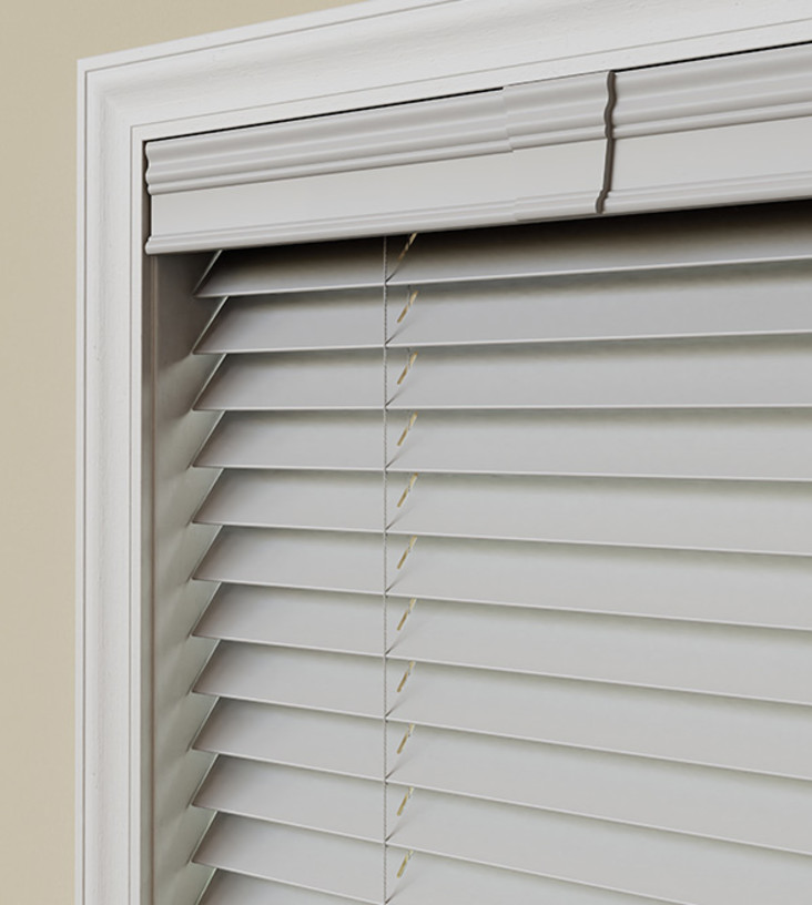 Wood blind featuring a valance with a keystone option.