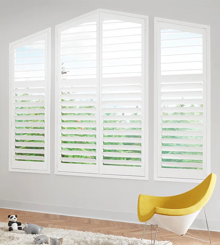 Angle top window shutters in child play room.
