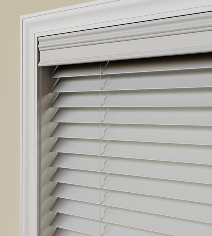  Wood blind featuring a decorative valance option.