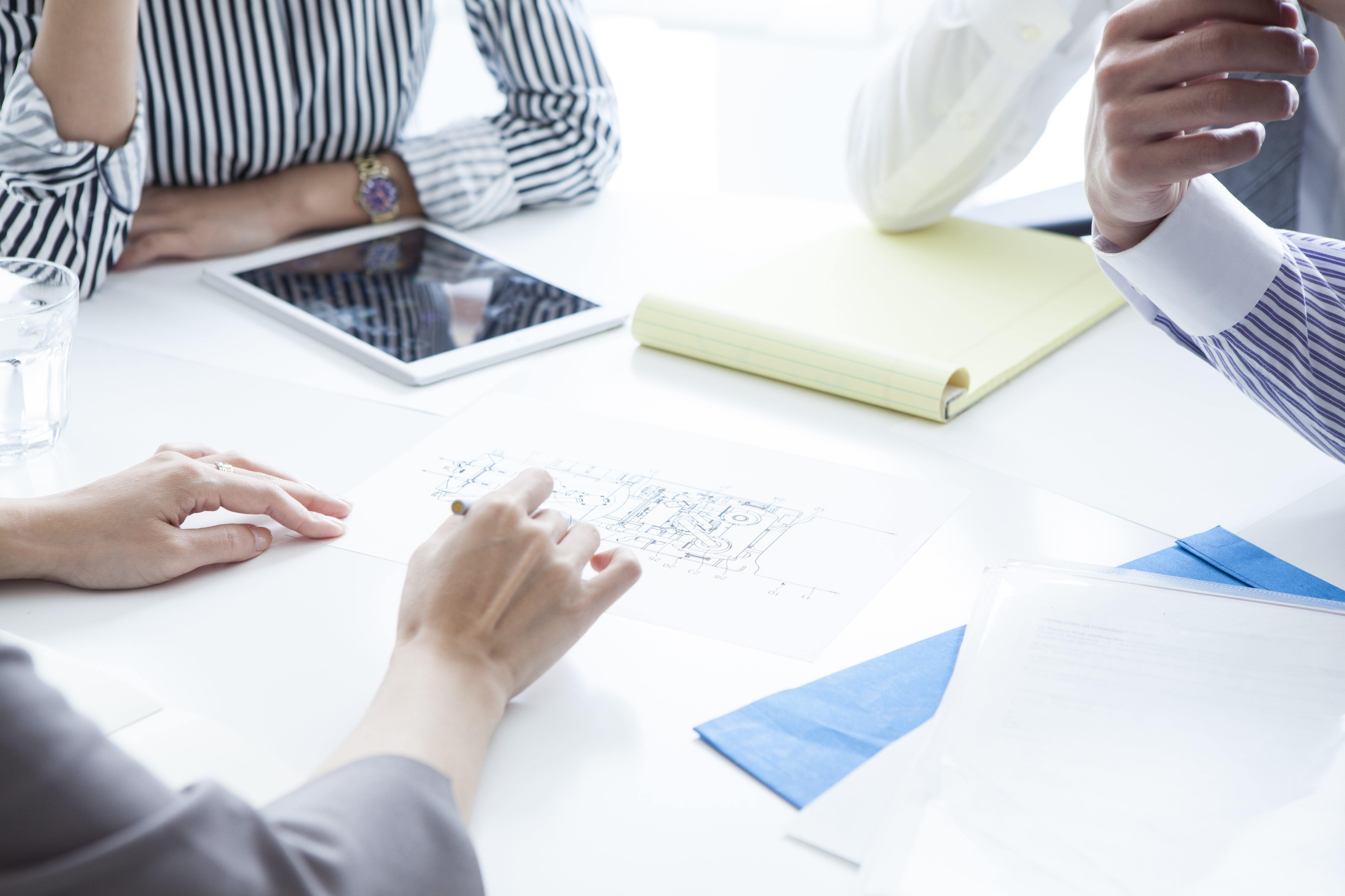 A group of people meeting and discussing strategy