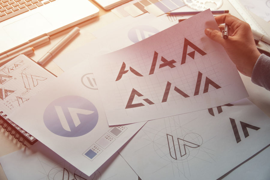Graphic designer development process drawing sketch design creative Ideas draft Logo product trademark label brand artwork.