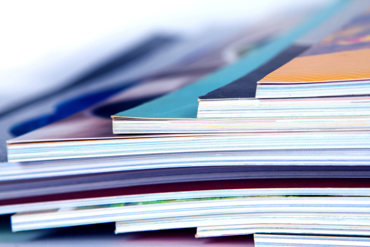 stack of colorful magazines, extreme DOF