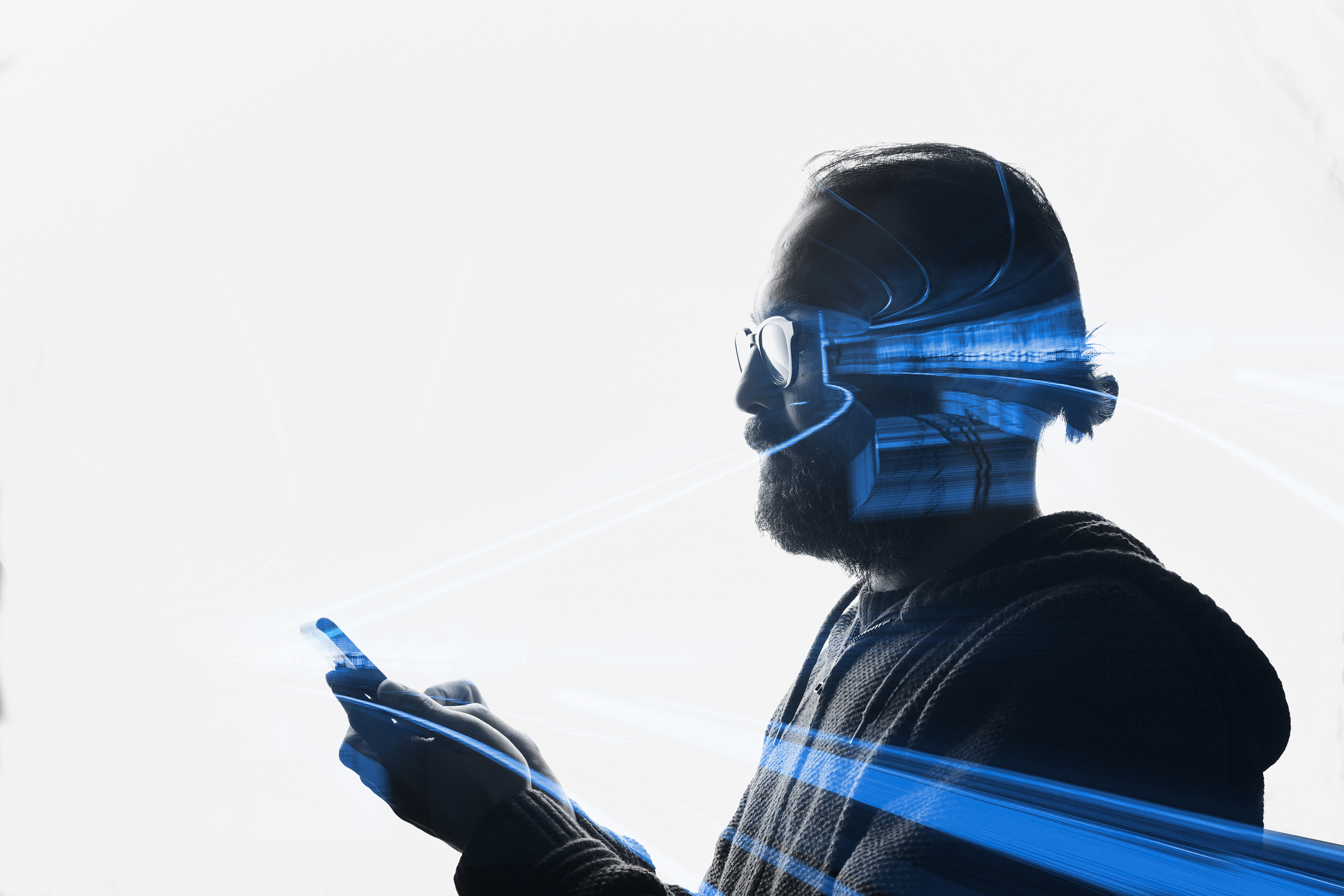 Photo of a man using a smart phone. | Watermark