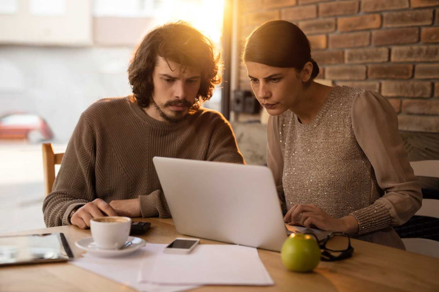 Two people searching for affordable SEO