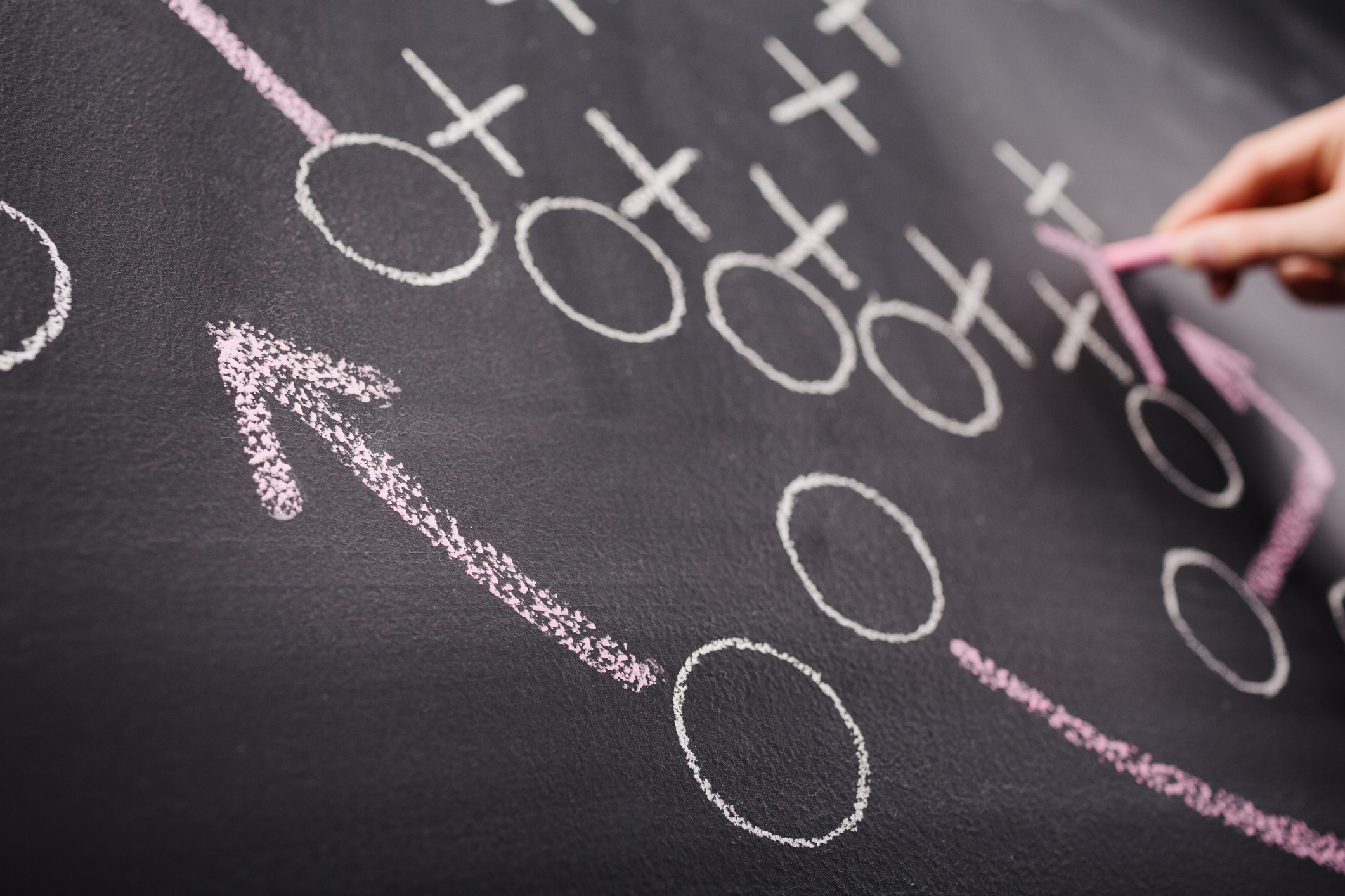 Hand drawing a game strategy as a metaphor for creating a digital marketing strategy. | Watermark