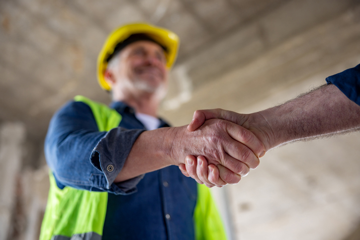 Close-up on a Construction Manager Handshaking a Client