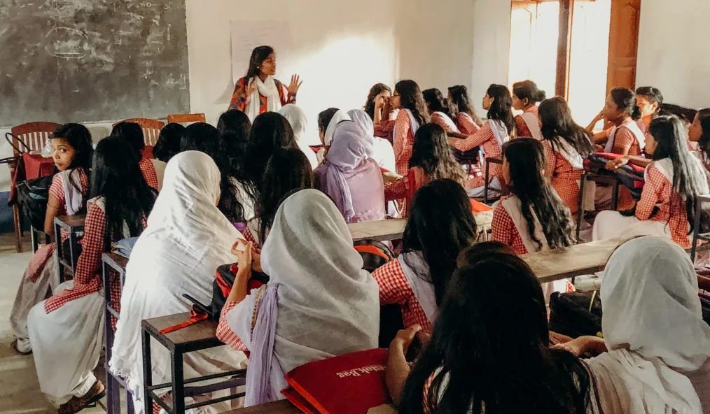 A Shadhika Scholar from the Jabala Action Research Organization hosting a community leadership workshop at a local high school, 2019