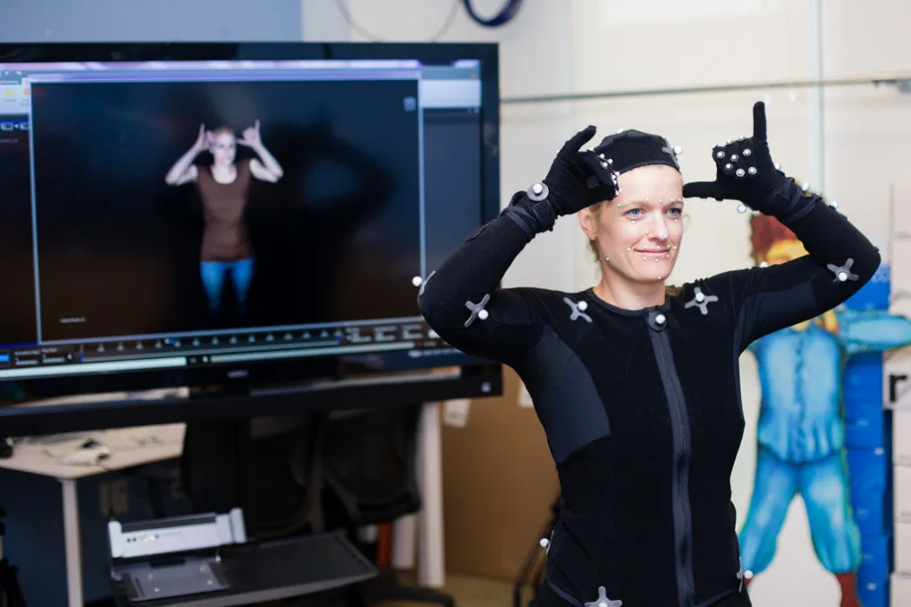 Melissa serving as a motion capture model to create a 3D avatar.