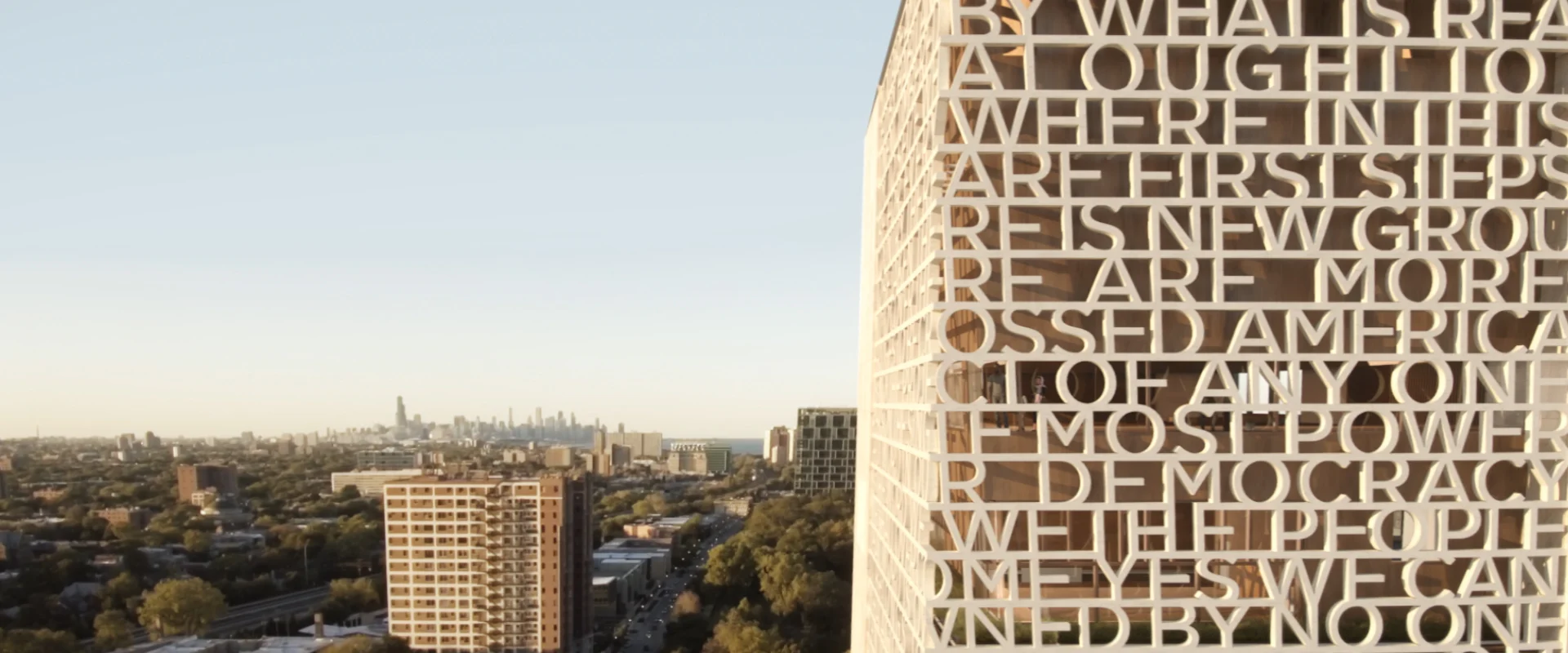 The corner of the Obama Presidential Center Museum is shown with the skyline of Chicago behind it.