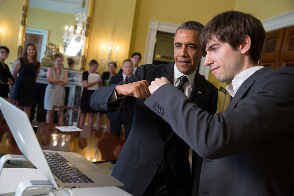 President Obama and Tumblr founder and CEO David Karp share a fist bump