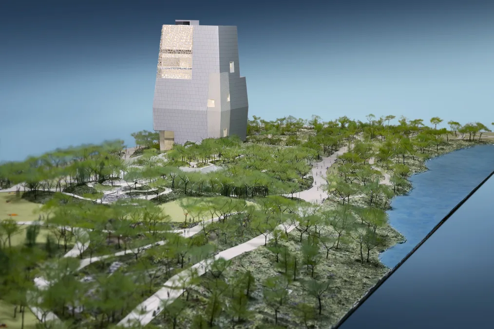 A rendering of the Obama Presidental Center's campus with greenland, trees, and water around the campus.