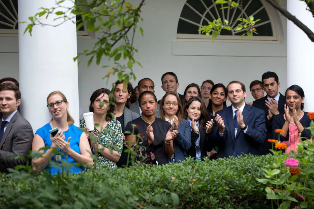 Staff listen to remarks by President Obama in the Rose Garden.