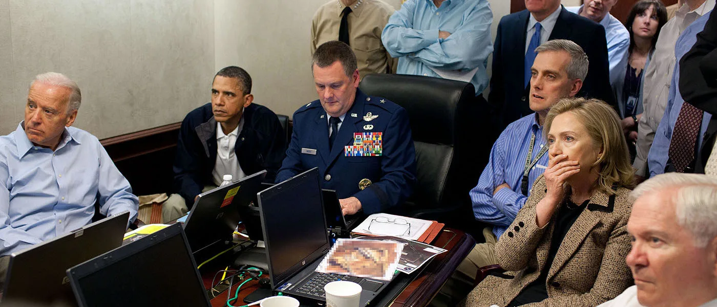 President Barack Obama wearing a navy blue jacket and a white polo shirt sits in a room with other individuals of a light skin tone. There is a brown table in front of them with four laptops and papers on it.​​​​‌﻿‍﻿​‍​‍‌‍﻿﻿‌﻿​‍‌‍‍‌‌‍‌﻿‌‍‍‌‌‍﻿‍​‍​‍​﻿‍‍​‍​‍‌‍​﻿‌‍﻿﻿‌‍﻿‍‌﻿‌​‌‍‌‌‌‍﻿‍‌﻿‌​‌‍‌‍‌﻿‌‌‌‍﻿​​‍﻿‍‌‍​﻿‌‍﻿﻿‌‍﻿‌​‍​‍​‍﻿​​‍​‍‌‍‍​‌﻿​‍‌‍‌‌‌‍‌‍​‍​‍​﻿‍‍​‍​‍‌‍‍​‌﻿‌​‌﻿‌​‌﻿​​‌﻿​﻿​﻿‍‍​‍﻿﻿​‍﻿﻿‌‍​‌‌﻿​​‌﻿​​​‍﻿‍‌‍​﻿‌‍﻿﻿‌‍﻿‍‌﻿‌​‌‍‌‌‌‍﻿‍‌﻿‌​‌‍‌‍‌﻿‌‌‌‍﻿​​‍﻿‍‌‍​﻿‌‍﻿﻿‌‍﻿‌​‍﻿﻿‌﻿​﻿‌﻿​​‌‍​‌‌‍​﻿‌‍‌‌‌﻿​﻿​‍﻿﻿‌‍﻿​​﻿‌﻿‌‍‍​​﻿‌‌​﻿‍‌‌‍‍​‌‍‌‍‌‍﻿‍‌‍﻿​‌﻿‍​‌‍‍‍‌﻿‍​​‍﻿﻿‌‍‌‌‌‍﻿‍‌﻿‌‍‌‍‍‌‌﻿​‍‌‍﻿﻿‌‍﻿‍‌‍﻿‌‌‍‌‌‌‍﻿‍‌﻿‌​‌﻿​﻿​‍﻿﻿‌‍﻿‌‌‍​‌‌﻿​﻿‌﻿‌​‌‍‌‌‌﻿​‍​‍﻿﻿‌‍‌‌‌‍﻿‍‌﻿‌​‌﻿​‍‌‍‍‌‌‍‌‌‌﻿​﻿​‍﻿﻿​﻿‌​‌‍‍​‌‌‌‌​﻿‍‌‌‌‌‍​﻿​﻿‌‍​‌‌​‍​‌​​﻿‌‌​﻿​﻿‌​‌﻿‌﻿‌​​‌‌﻿​‌‌​﻿﻿​﻿‌‌‌‌​​‌‍‍‌‌​‍‌‌‍​‍​﻿‌﻿‌﻿‌‍​‍﻿﻿​﻿﻿﻿‌‍‌‍‌‍﻿﻿‌‍​﻿‌﻿‌‌‌﻿​﻿‌‍‌‌‌‍‌​‌​‌‍‌‍‍‌‌‍‌‌‌‍﻿​‌‍‌​​﻿﻿‌‌‍​‌‌‍﻿​‌﻿‌​‌‌‌​‌‍‌‌‌﻿‍​‌﻿‌​​‍‌‍‌‍‌‍‌‍﻿﻿‌‍​﻿‌﻿‌‌‌﻿​﻿‌‍‌‌‌‍‌​‌​﻿​‌‍﻿﻿‌‍​﻿‌‍​‌‌‍﻿​‌‍‌‌​﻿﻿‌‌‍‌‌‌‍﻿‍​‍﻿‌‌‌‌‌‌‌​﻿​‍‌‍‌﻿​﻿‌‍﻿﻿‌﻿‌‌‌﻿​‍‌‍​﻿‌‍‌‌​﻿﻿‌‌﻿‌‍‌‍‌‌‌﻿​‍‌‍​﻿‌‍‌‌‌‍﻿​​‍﻿‌‌‍​﻿‌‍﻿﻿‌‍﻿‍‌﻿‌​‌‍‌‌‌‍﻿‍‌﻿‌​​‍﻿‌‌‍﻿​‌‍‍‌‌‍﻿‍‌‍‍﻿​‍​‍​‍﻿​​‍​‍‌‍​﻿‌‍﻿﻿‌‍﻿‍‌﻿‌​‌‍‌‌‌‍﻿‍‌﻿‌​‌‍‌‍‌﻿‌‌‌‍﻿​​‍​‍​﻿‍‍‌﻿‍﻿​‍​‍‌‍‌‌‌‍‌​‌‍‍‌‌﻿‌​‌‍﻿﻿‌﻿​‍‌​‍‌‌‍﻿‍‌﻿‌​‌‍‌‌‌﻿​‍‌‍‌‍‌‍​‌‌‍​﻿‌‍‌‌​‍​‍​﻿‍‍‌﻿‍﻿​‍​‍‌﻿‌﻿‌‍‍‌‌‍‌​‌‍‌﻿‌‍‌‌‌﻿‌​‌​‍‌‌‍‌​​‍​‍​﻿‍‍​‍​‍‌‍﻿‌‌﻿‌‌‌‍﻿​‌﻿‌​‌‍‍‌‌﻿​​‌‍﻿​‌‍‌‌‌​﻿​‌‍‍‌‌‍﻿‍‌‍‌‌​‍​‍​‍﻿​​‍​‍‌﻿‌﻿‌‍‍‌‌‍‌​‌‍‌﻿‌‍‌‌‌﻿‌​‌​﻿‍‌‍​‌‌‍﻿‌‌‍‌‌‌﻿​﻿‌﻿​​‌‍​‌‌‍​﻿‌‍‌‌​‍​‍​﻿‍‍​‍​‍‌‍​‍‌﻿‌‌‌‍‍‌‌‍﻿​‌﻿‌​‌‍‍‌‌‍﻿‍​‍​‍‌﻿﻿‌​‍﻿​​‍​‍‌‍‌‍‌‍‍‌‌‍‌‌‌‍﻿​‌‍‌​‌‌‌​‌﻿‍‌‌﻿​​‌‍‌‌​‍​‍​﻿‍‍​‍​‍‌‌‌​‌‍‌‌‌﻿‍​‌﻿‌​​‍​‍‌﻿﻿‌‌﻿﻿‌