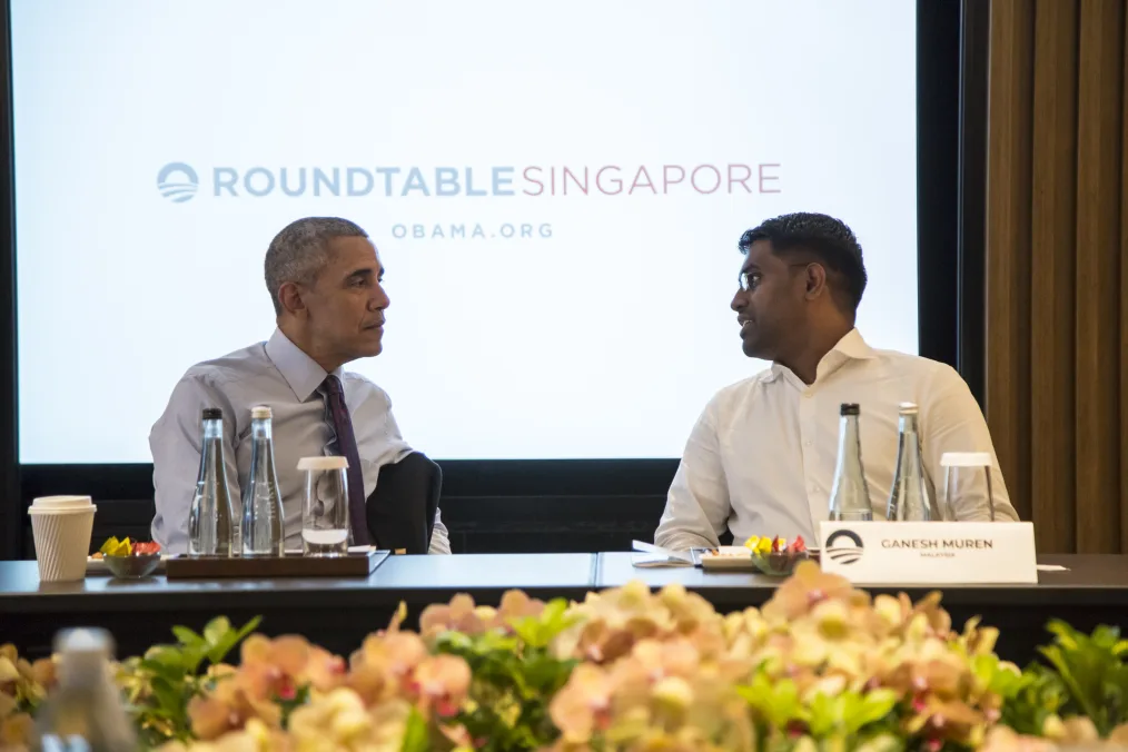 President Obama greets Ganesh Muren at the roundtable conversation in Singapore on March 19, 2018.