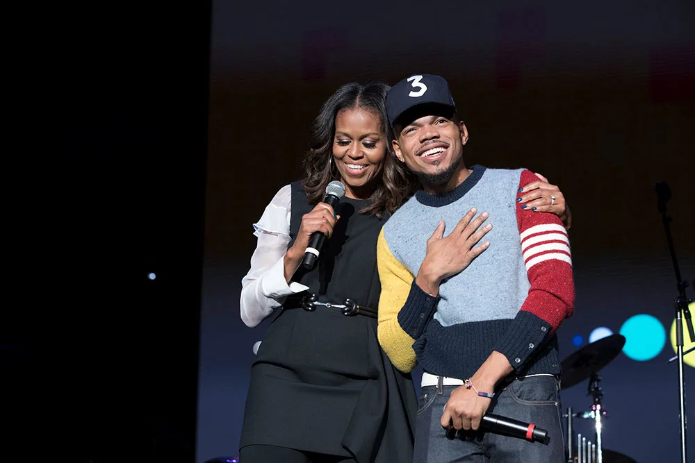 Mrs. Obama and Chance the Rapper speak to the crowd at the Community Event, which concluded the inaugural Obama Foundation Summit.