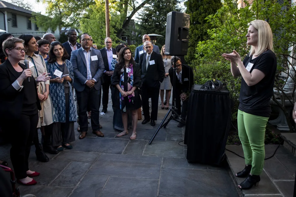 Melissa speaking at a reception of 2018 Obama Fellows