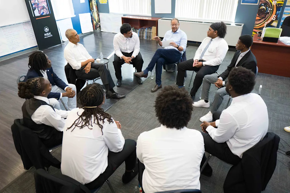 photo of moderator speaking with President Obama, with MBK Youth in the frame as well.