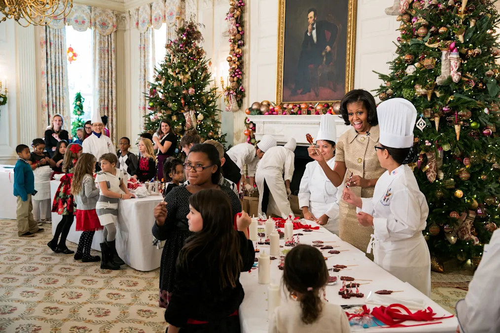 Mrs. Obama hosts young chefs, with a range of ages and light to dark skin tones, at the White House. 