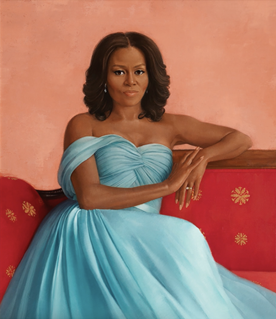 First Lady Michelle Obama wears a formal blue dress and is seated on a sofa in the Red Room. 