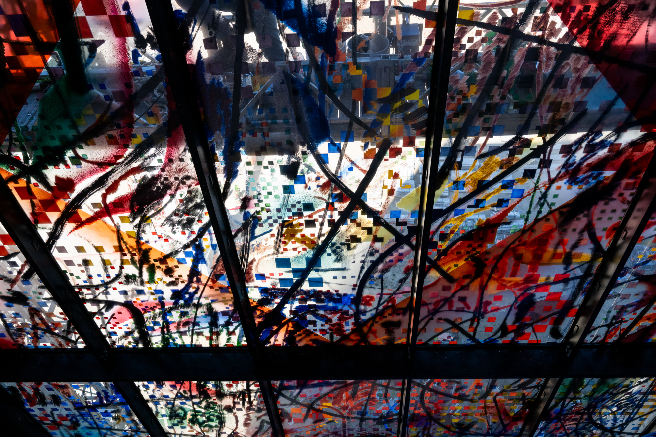 A closeup of Julie Mehretu’s glass installation, “Uprising of the Sun.”